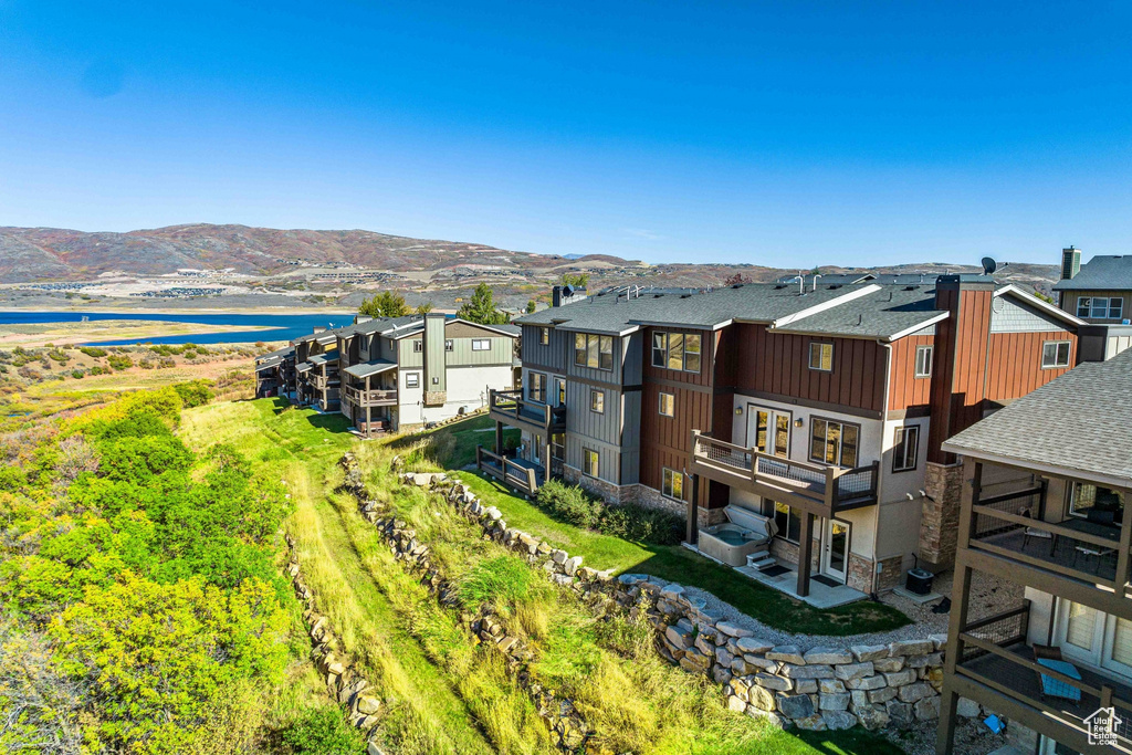 Aerial view featuring a water and mountain view