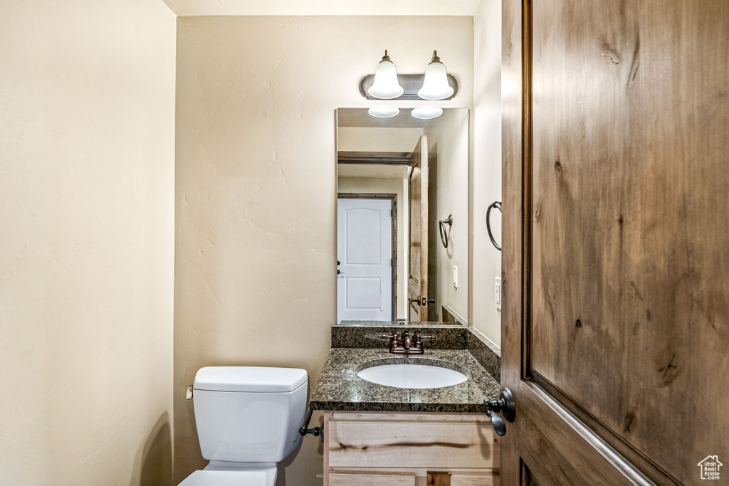 Bathroom with vanity and toilet