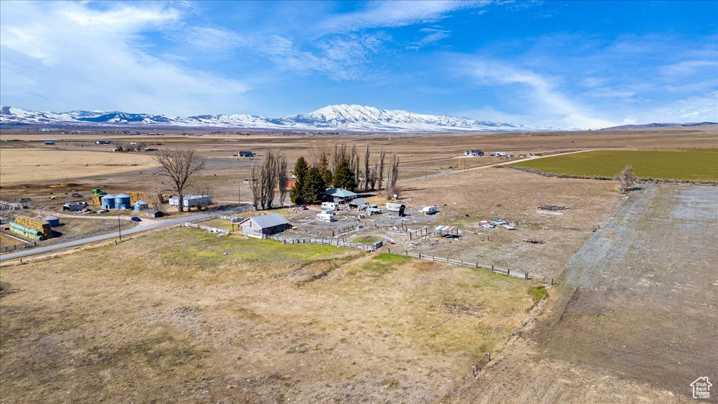 Birds eye view of property with a mountain view and a rural view