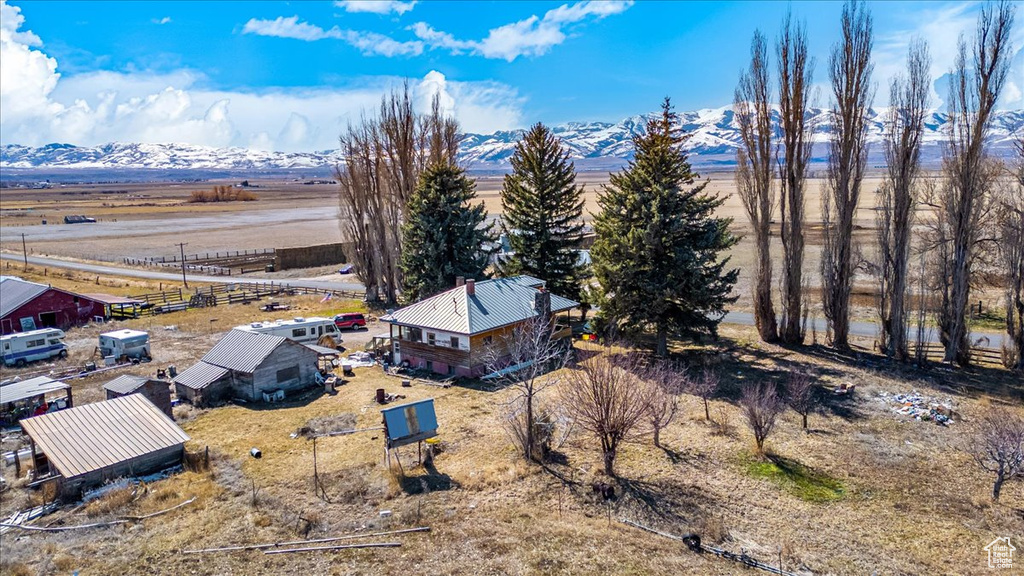 Birds eye view of property with a rural view and a mountain view