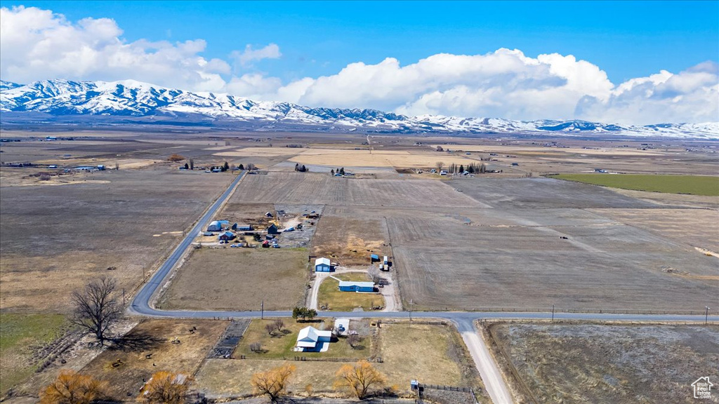 Birds eye view of property with a mountain view and a rural view