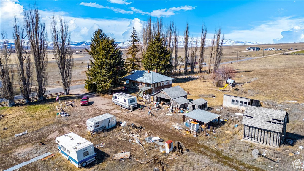 Birds eye view of property with a rural view and a mountain view