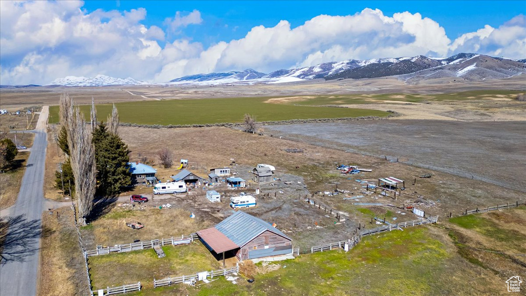 Birds eye view of property featuring a mountain view and a rural view