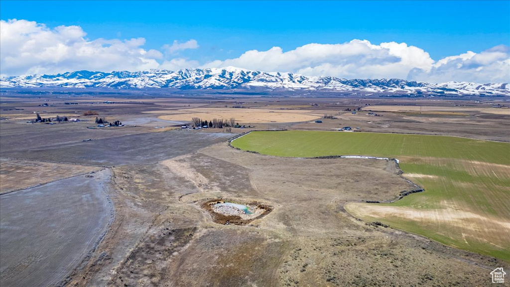 Birds eye view of property with a mountain view