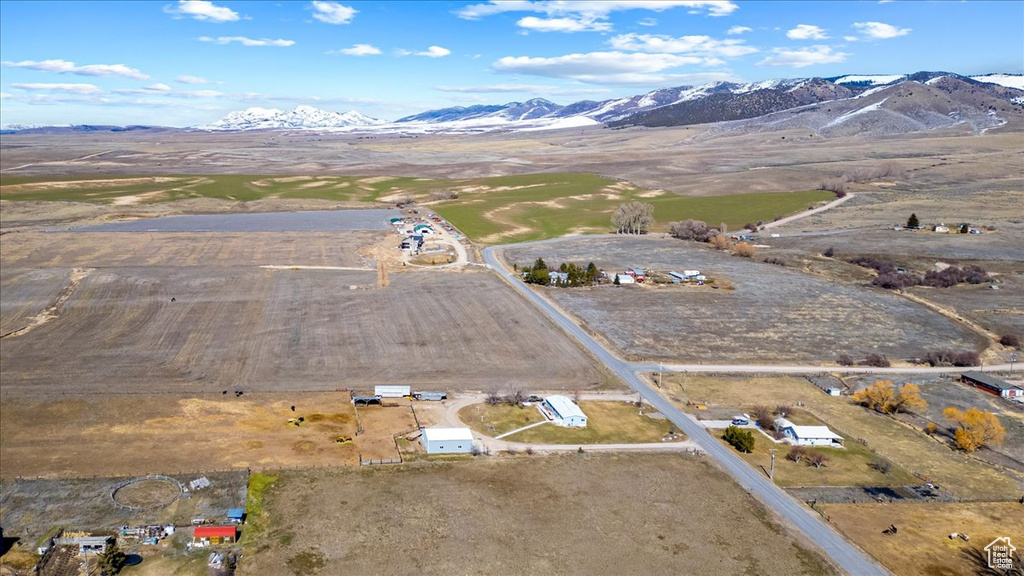 Birds eye view of property with a mountain view and a rural view