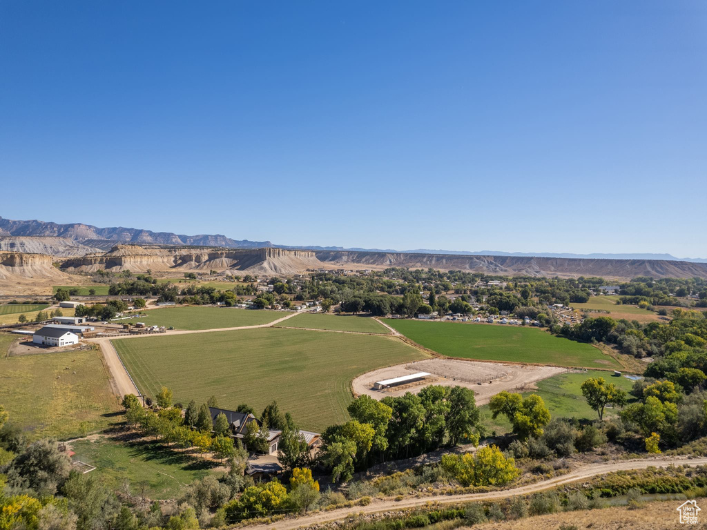 Birds eye view of property with a mountain view and a rural view