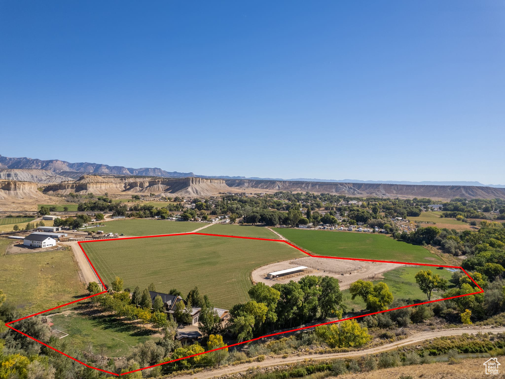 Drone / aerial view with a mountain view and a rural view