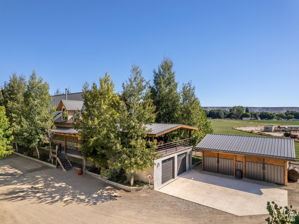 View of front of house featuring an outdoor structure