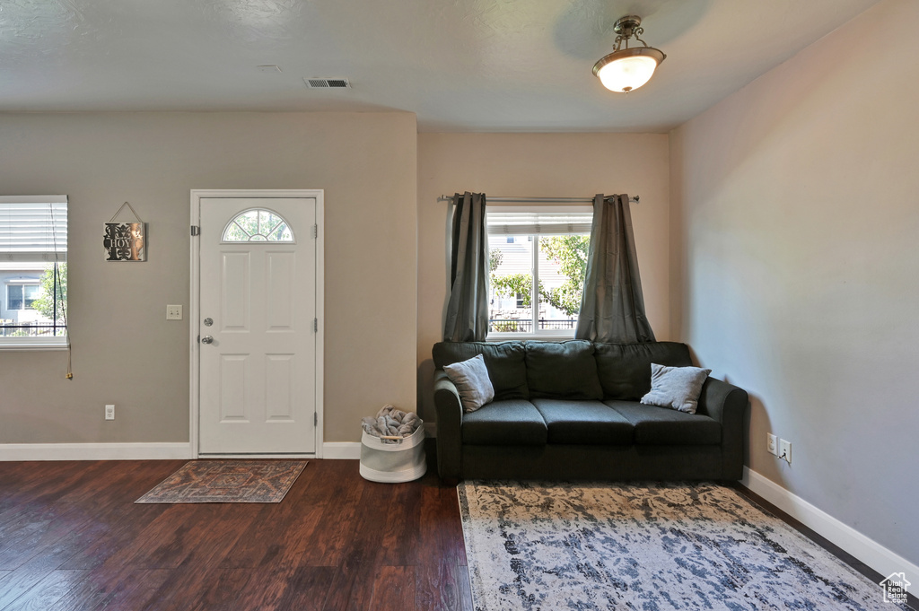 Foyer with hardwood / wood-style floors