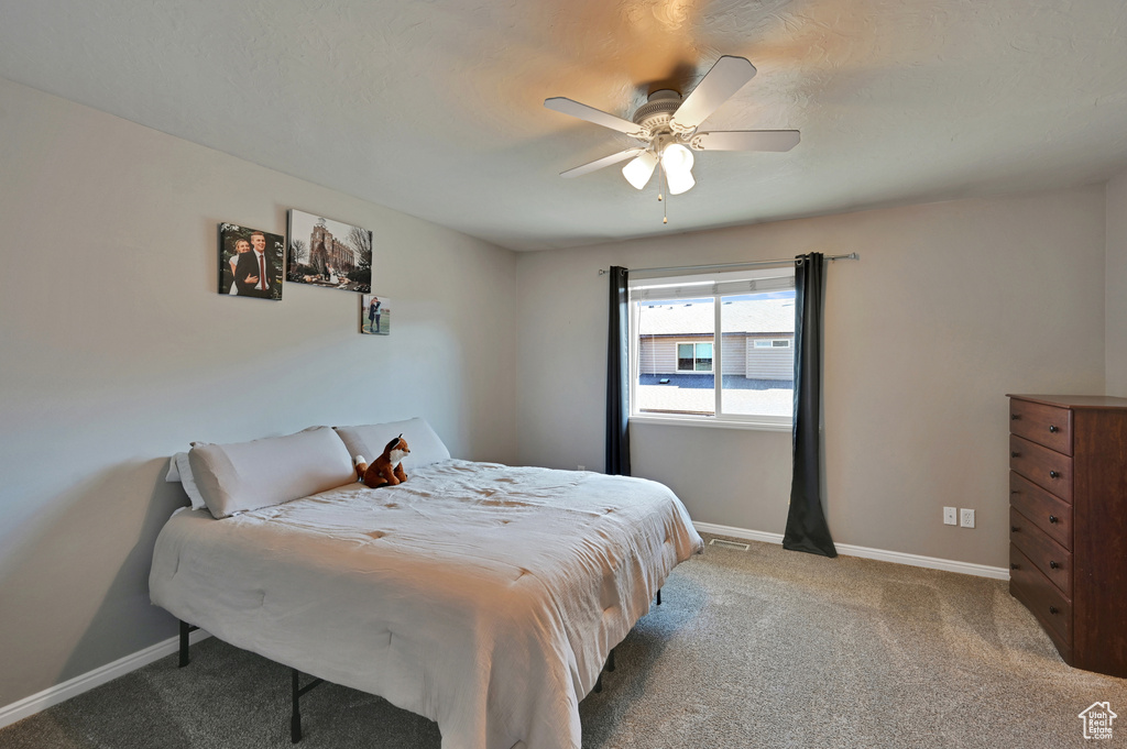 Bedroom featuring carpet flooring and ceiling fan