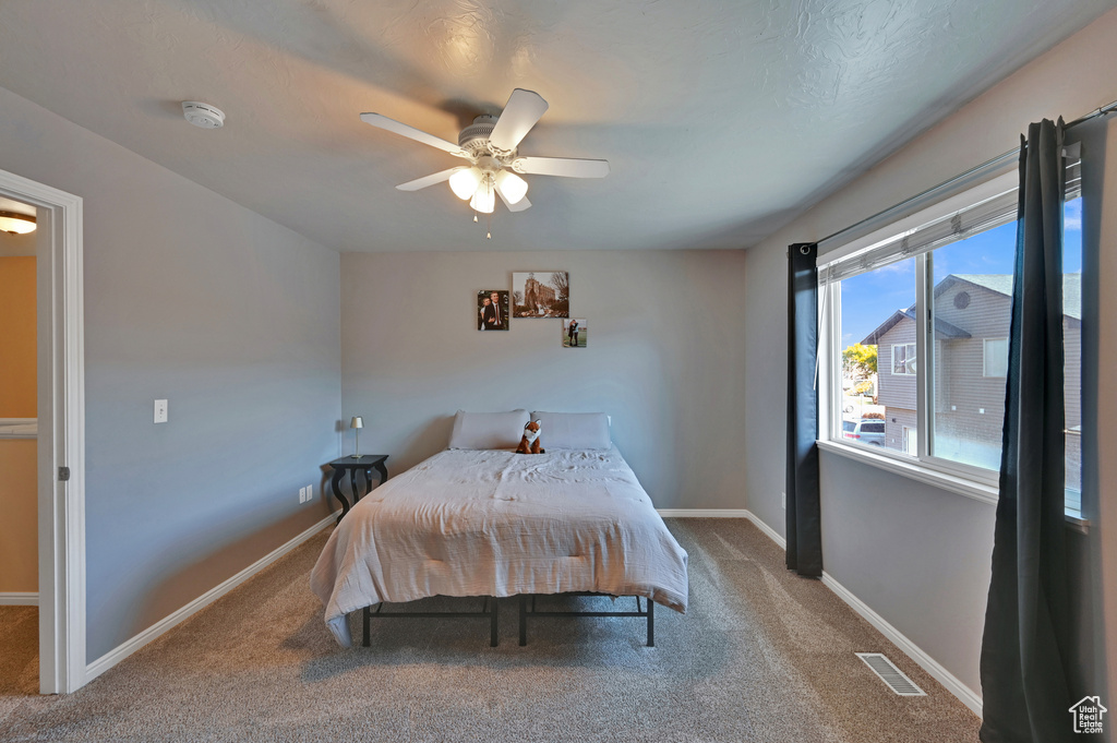 Bedroom with carpet and ceiling fan