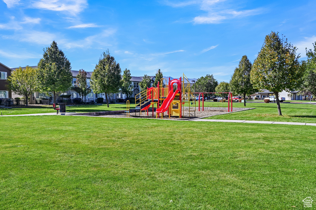 View of playground with a lawn