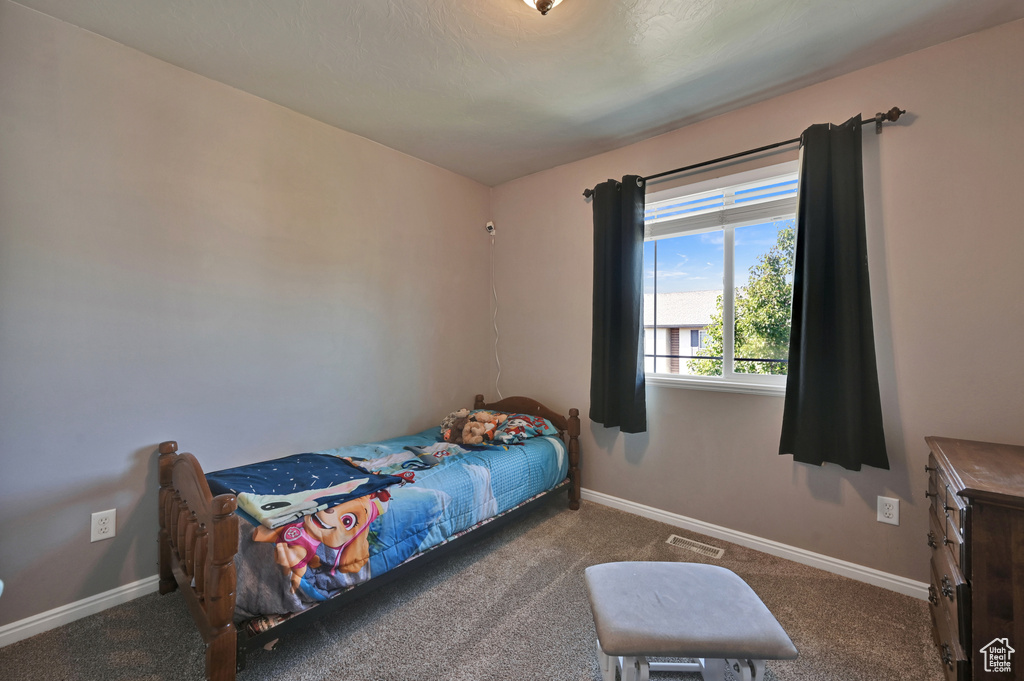 Bedroom featuring carpet