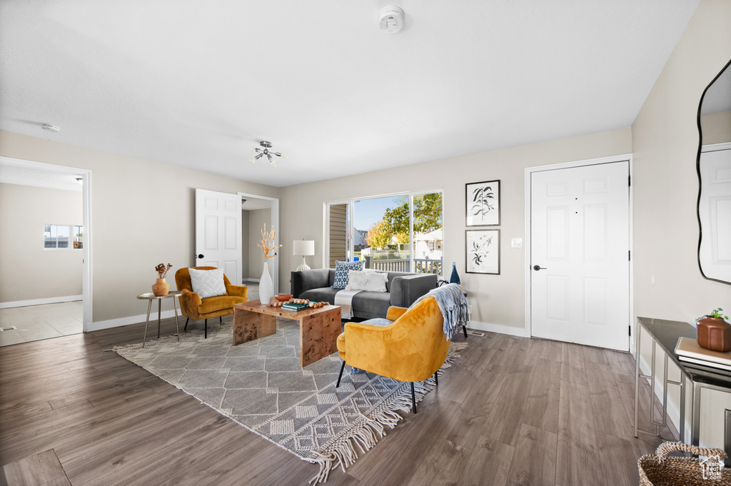 Living room with wood-type flooring