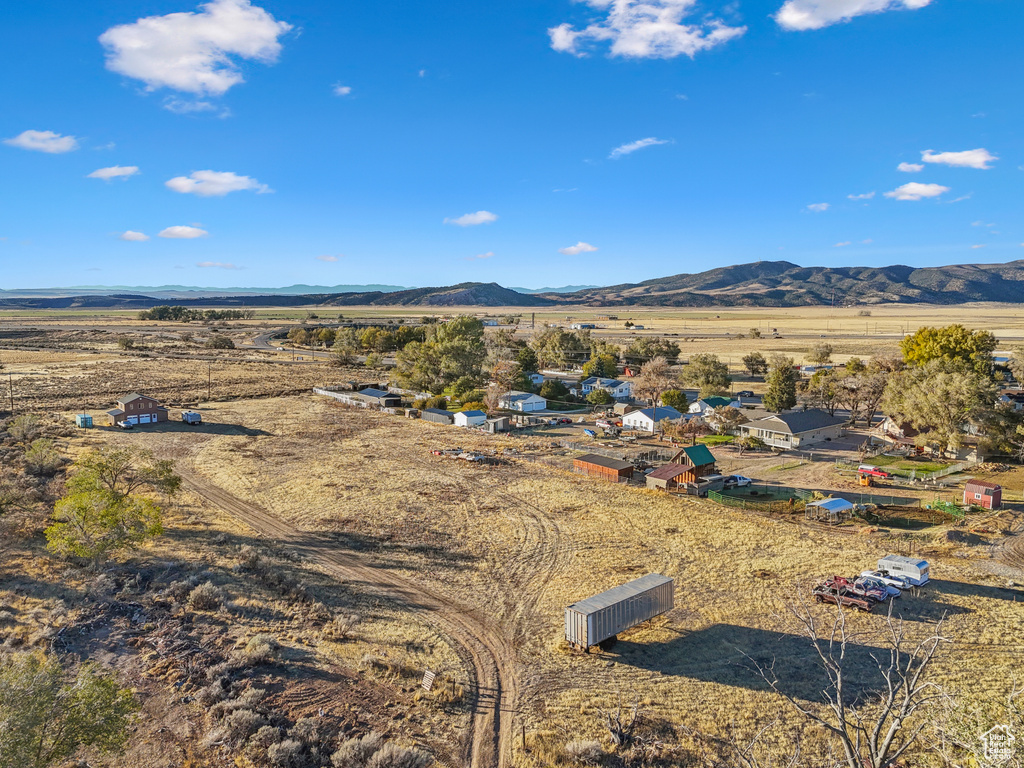 Birds eye view of property with a mountain view