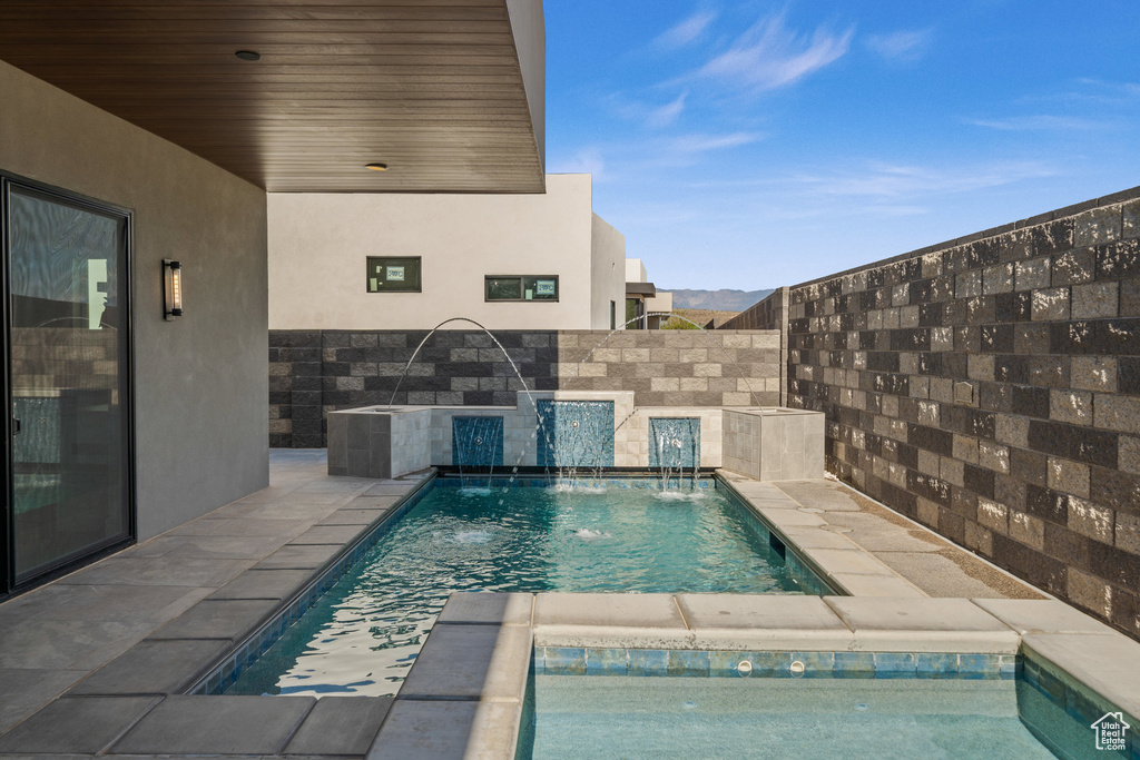 View of swimming pool with pool water feature