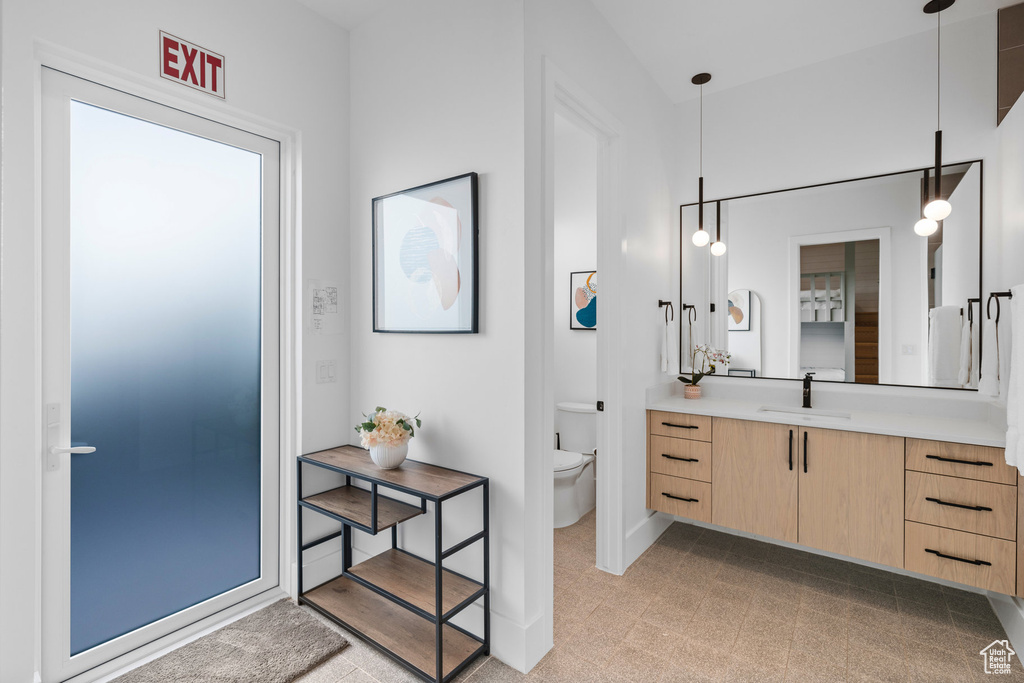 Bathroom featuring vanity and toilet