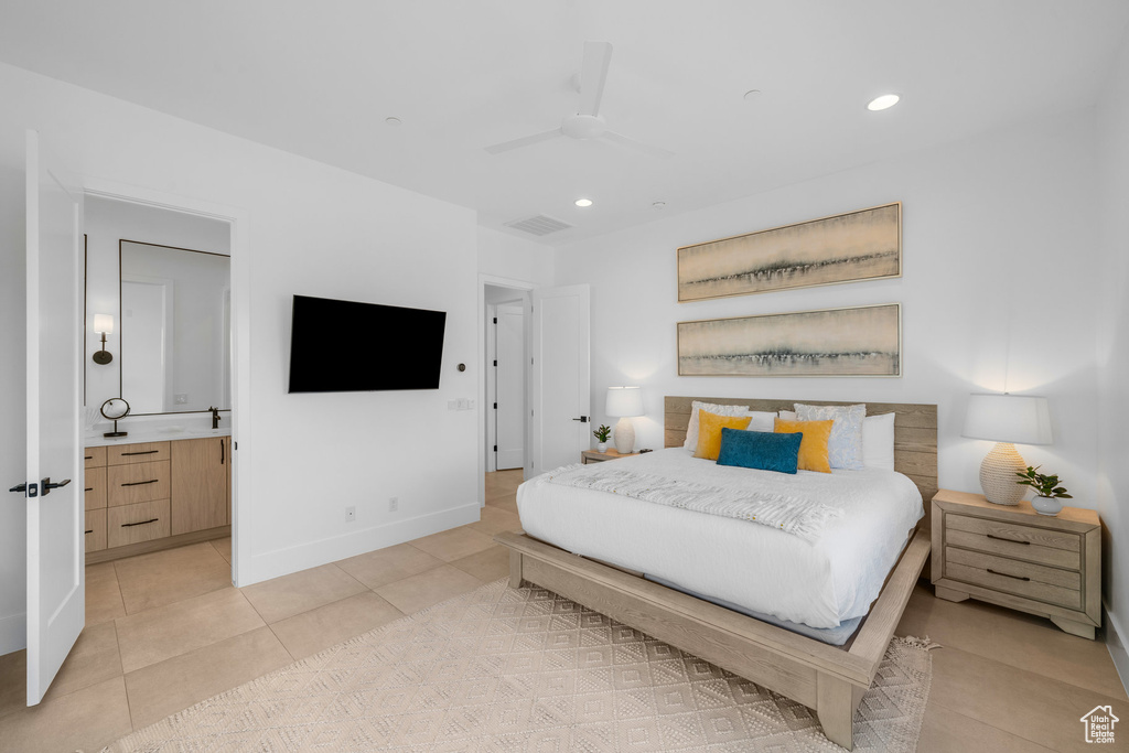 Tiled bedroom with connected bathroom and ceiling fan