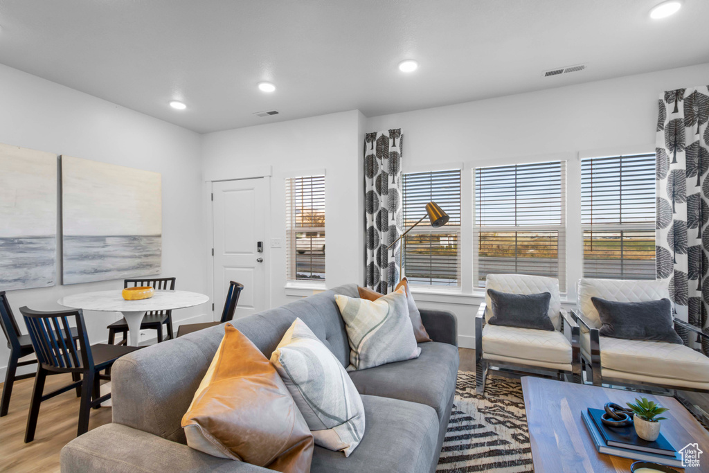 Living room with hardwood / wood-style flooring