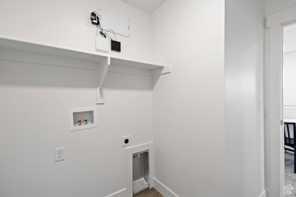 Laundry area with hookup for a washing machine and electric dryer hookup