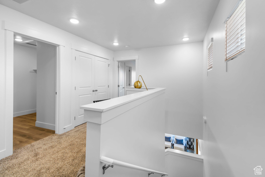 Hall with hardwood / wood-style floors