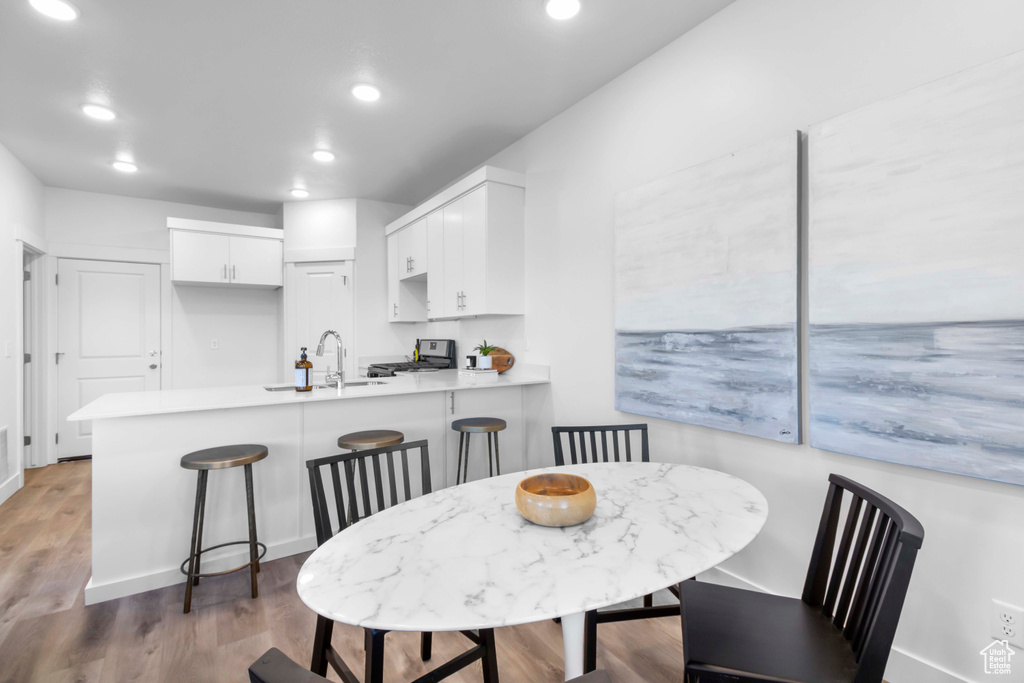 Dining room featuring dark hardwood / wood-style floors and sink