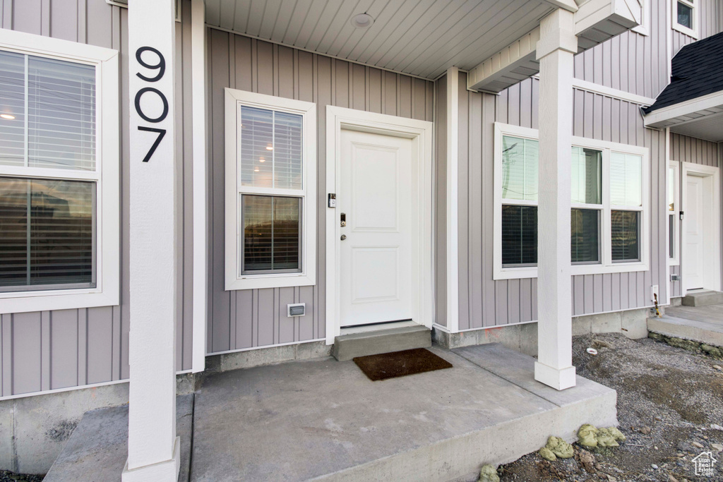 View of exterior entry featuring a porch