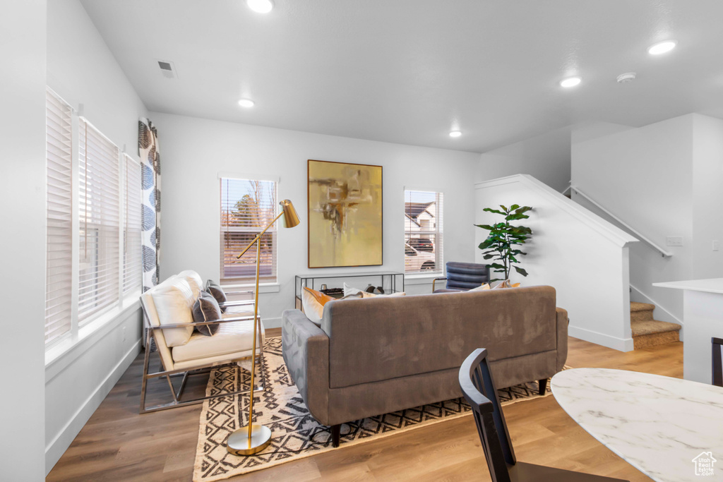 Living room with hardwood / wood-style flooring