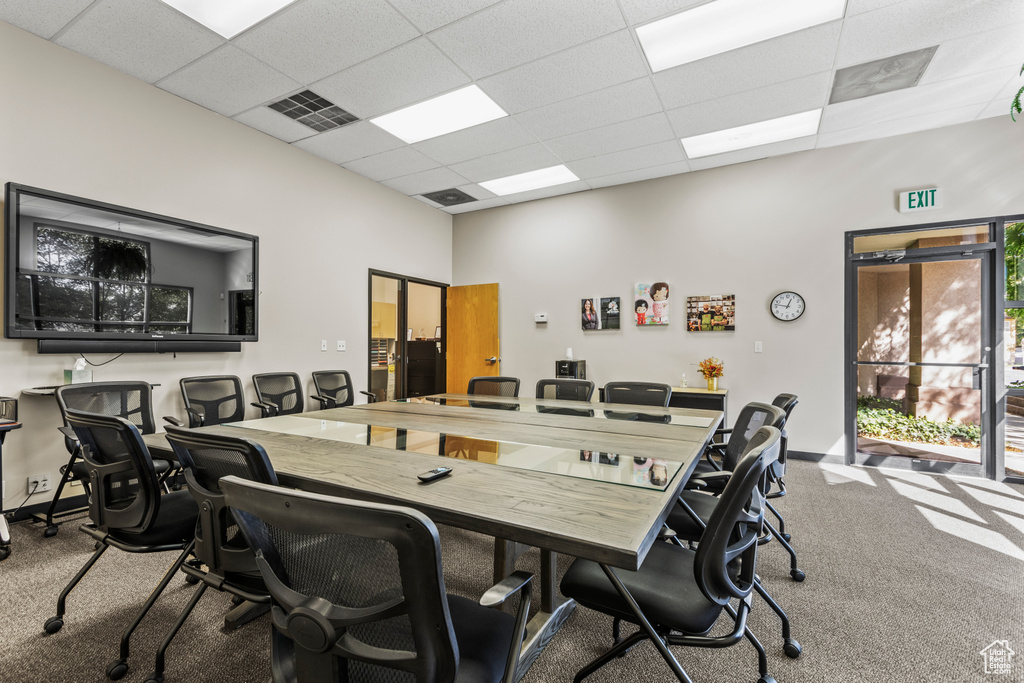 Carpeted office with a drop ceiling