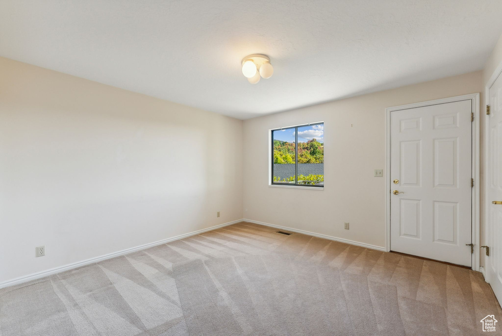 View of carpeted spare room