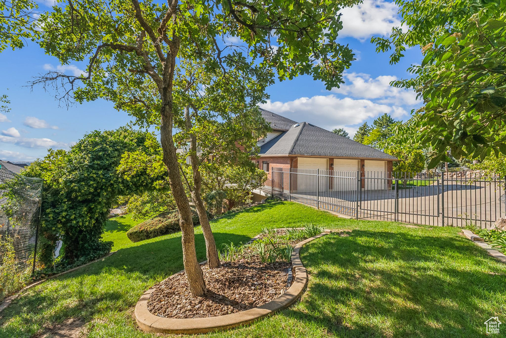 View of yard featuring a garage