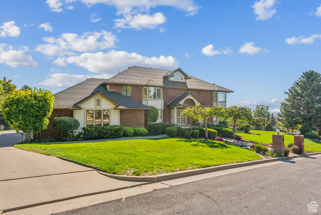 View of front of house with a front lawn