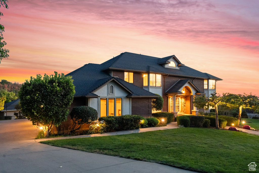 View of front of home featuring a yard