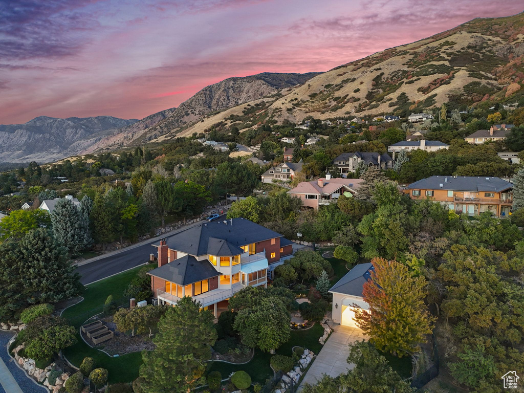 Aerial view at dusk featuring a mountain view