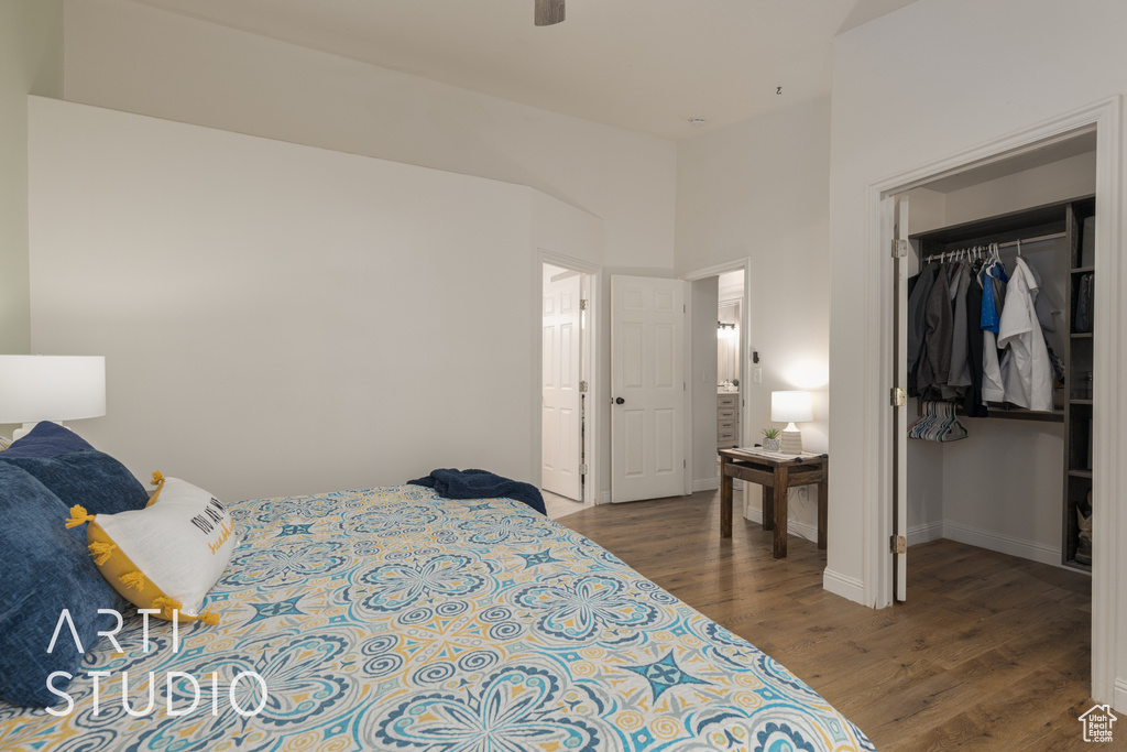 Bedroom with a closet and dark hardwood / wood-style floors