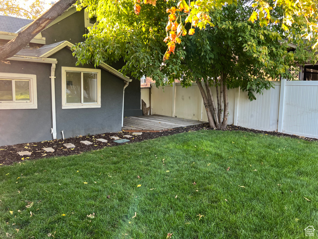 View of yard featuring a wooden deck