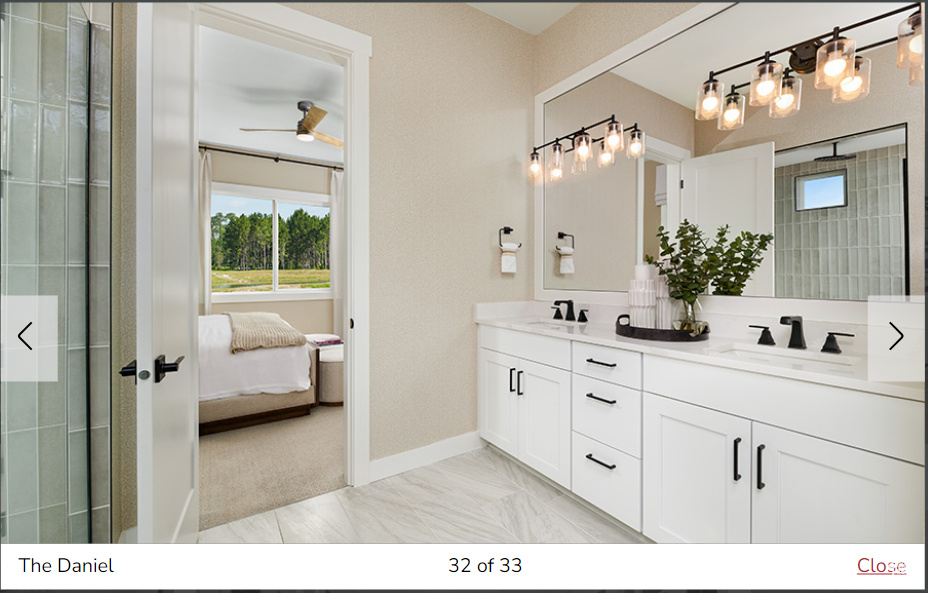 Bathroom with walk in shower, vanity, and ceiling fan