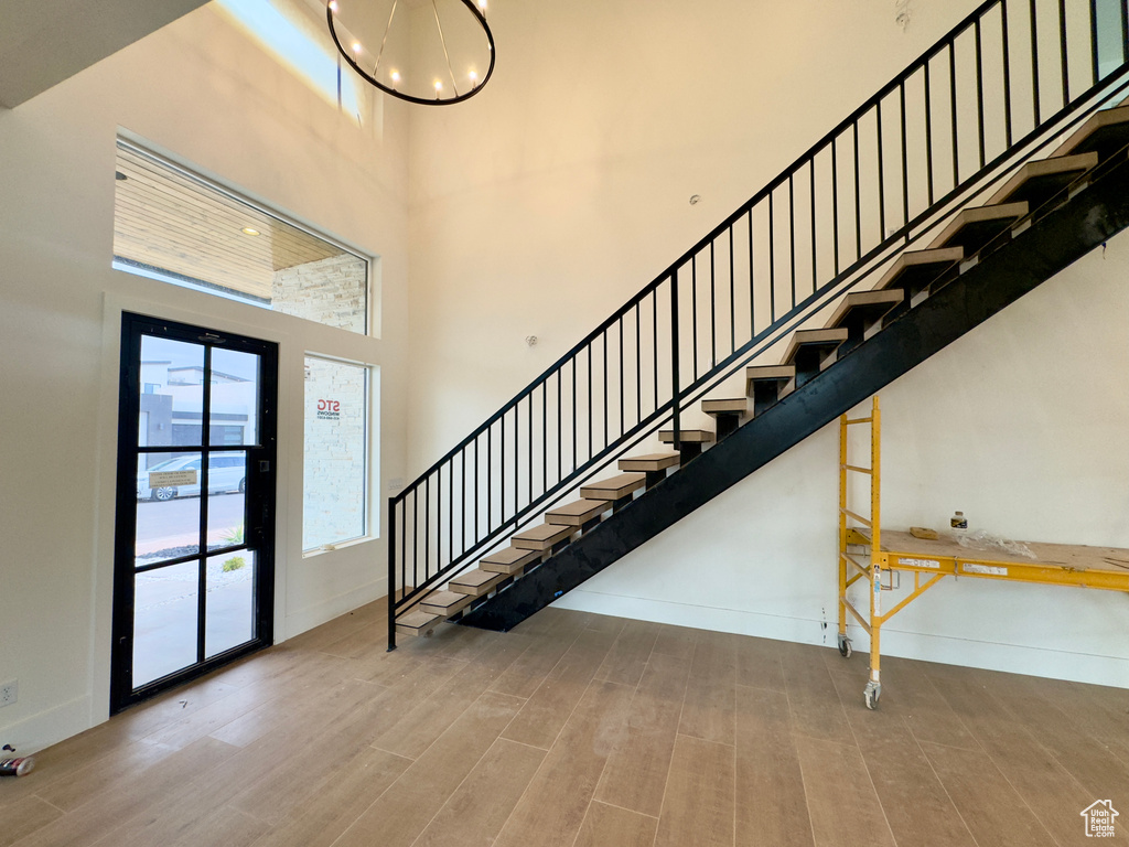 Entryway featuring hardwood / wood-style flooring and a high ceiling