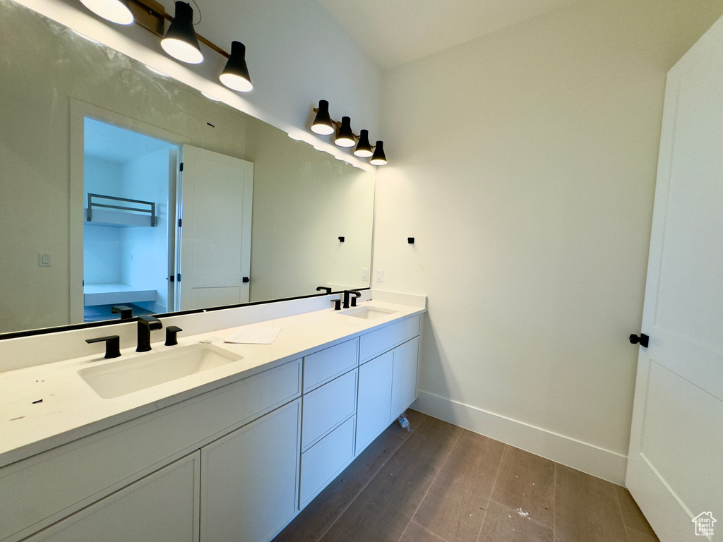 Bathroom with wood-type flooring and vanity