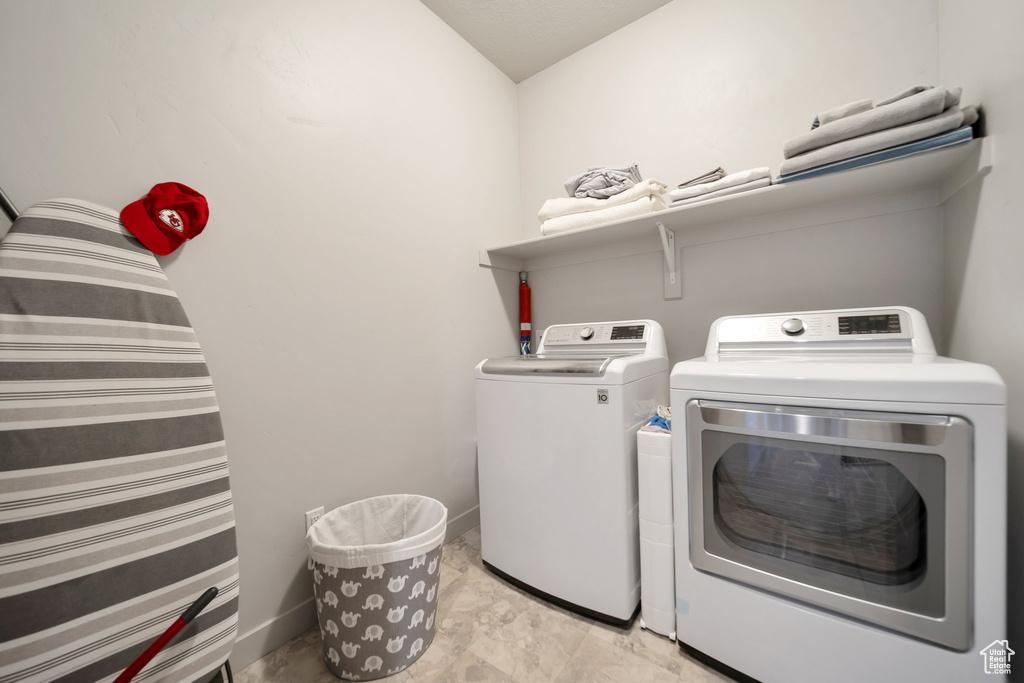 Laundry room with washer and dryer