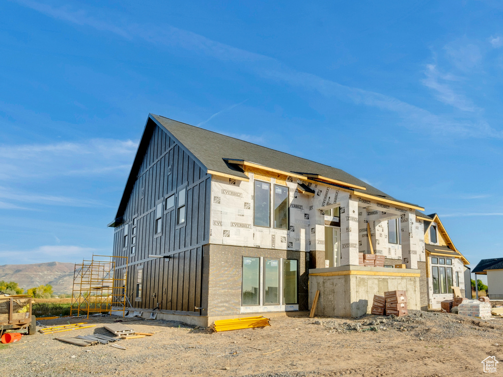 Rear view of house with a mountain view