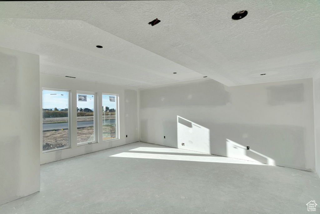 Empty room with a textured ceiling