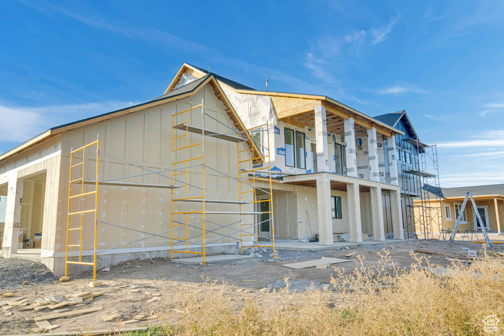 Rear view of property featuring a balcony