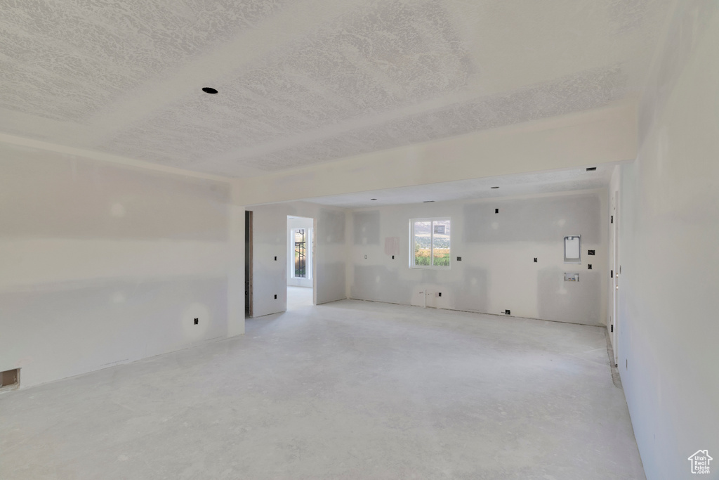 Unfurnished room with a textured ceiling