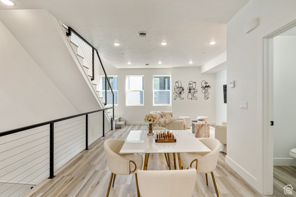 Dining area with light hardwood / wood-style floors