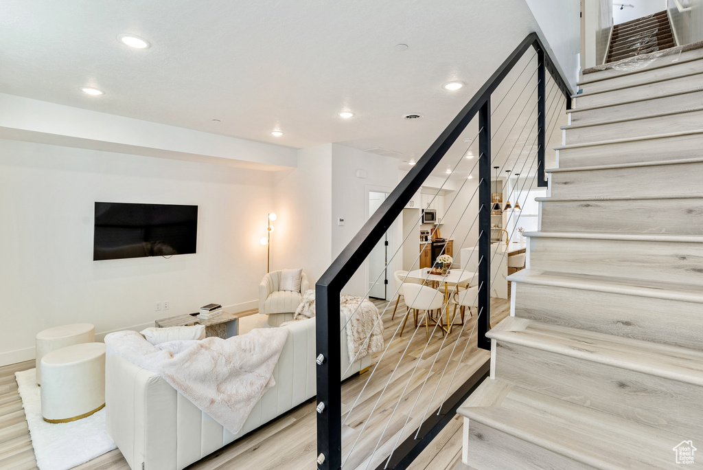 Living room with light wood-type flooring