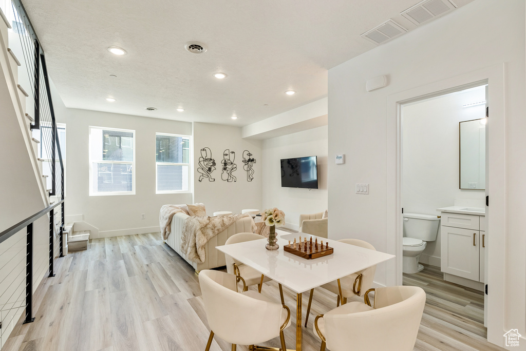 Dining space with light wood-type flooring