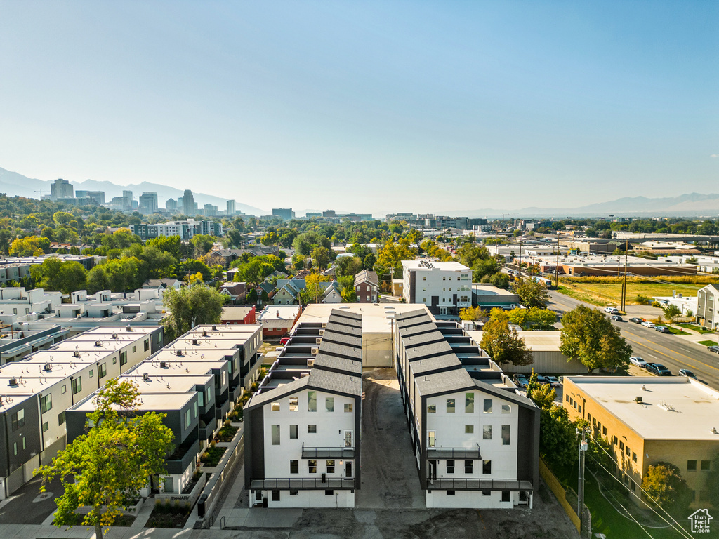 Birds eye view of property with a mountain view