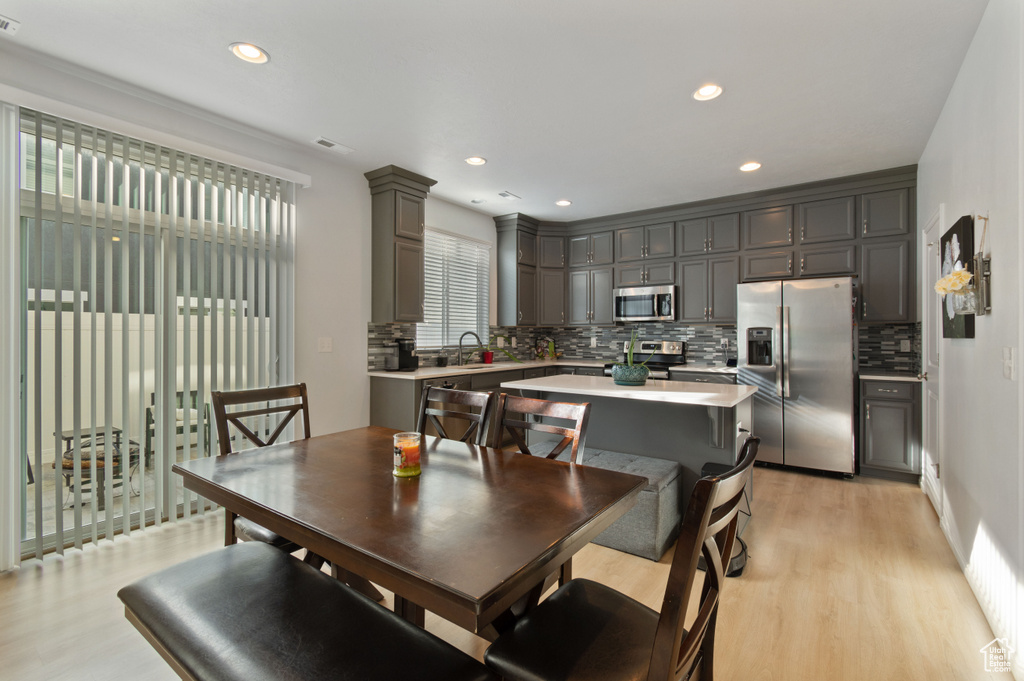 Dining area featuring light hardwood / wood-style flooring and sink