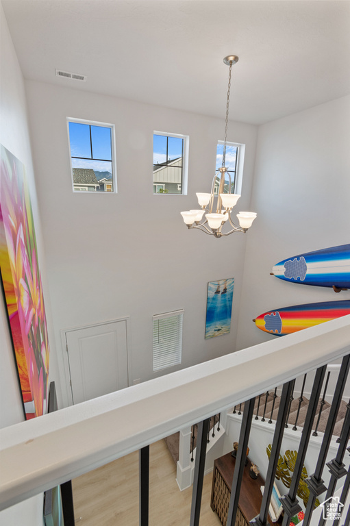 Interior details featuring hardwood / wood-style floors and a chandelier